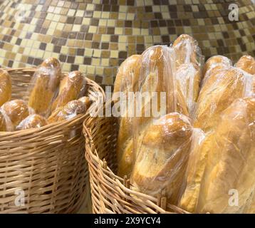 Buns in wicker basket. Composition with bread and rolls Stock Photo
