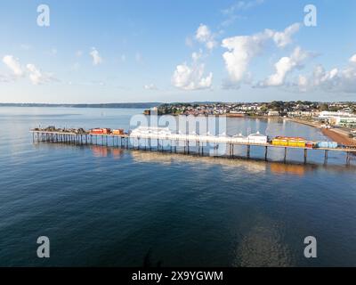 Aerial image taken by drone of Paignton Pier in Devon reaching out to sea on a calm sunny day Stock Photo