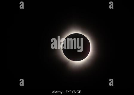 The total solar eclipse with a bright light eclipse in a dark space Stock Photo