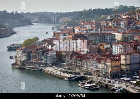 Porto,Portugal, Douro river and local houses with orange roofs in Porto city aerial panoramic view. Porto is the second largest city in Portugal. Stock Photo