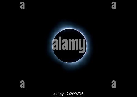 A solar eclipse featuring a diamond ring effect and baileys beads Stock Photo