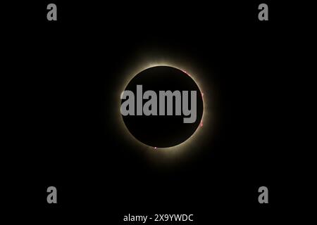 A solar eclipse featuring a diamond ring effect and baileys beads Stock Photo