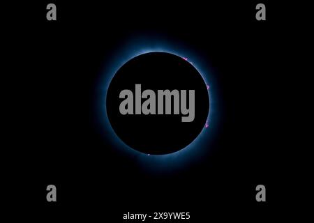 A solar eclipse featuring a diamond ring effect and baileys beads Stock Photo