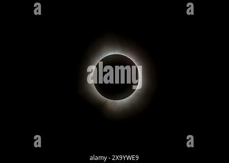 A solar eclipse featuring a diamond ring effect and baileys beads Stock Photo