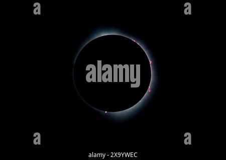 A solar eclipse featuring a diamond ring effect and baileys beads Stock Photo