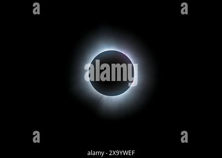 A solar eclipse featuring a diamond ring effect and baileys beads Stock Photo
