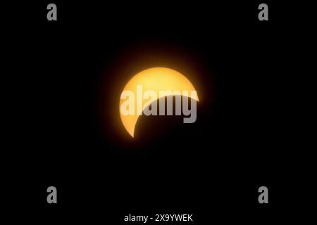 A solar eclipse featuring a diamond ring effect and baileys beads Stock Photo