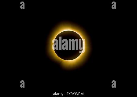 A solar eclipse featuring a diamond ring effect and baileys beads Stock Photo
