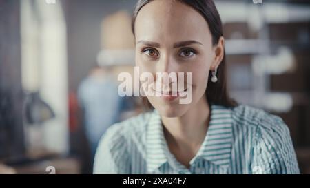 Portrait of a Successful Small Business Owner Smiling, Looking at Camera. Empowering Attractive Caucasian Female in a Warehouse Storeroom with Orders Ready for Shipment. Stock Photo