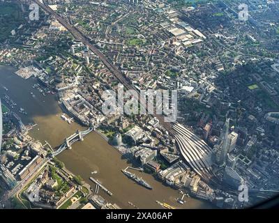 Over London, UK  - East End and City,  9th May, 2024  Aerial view over the City of London, showing the area around The Tower of London, Tower Bridge, Stock Photo