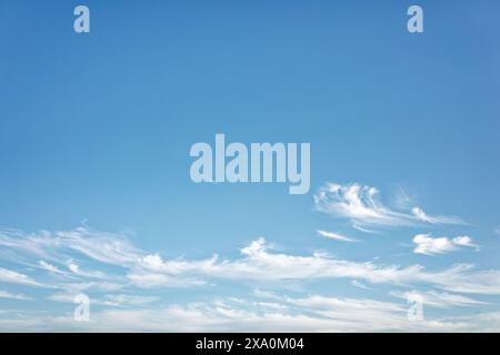 A clear blue sky with fluffy white clouds. Stock Photo