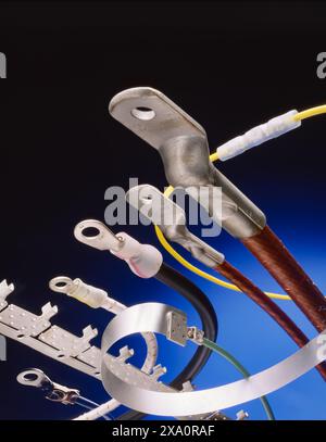 Close-up of electrical ring terminals and connectors with insulated wiring, symbolizing power distribution, connectivity, engineering precision. Stock Photo