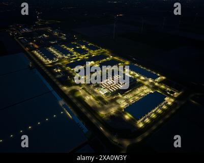 Large scale data center building complex in Middenmeer, The Netherlands, at night. Stock Photo
