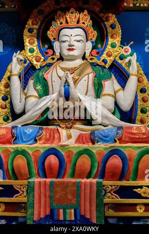 Buddhist temple interior featuring ornate decorations, statues of buddha, and traditional architecture. Serene atmosphere with intricate details, gold Stock Photo