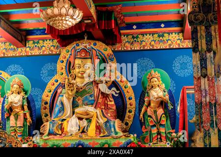 Buddhist temple interior featuring ornate decorations, statues of buddha, and traditional architecture. Serene atmosphere with intricate details, gold Stock Photo