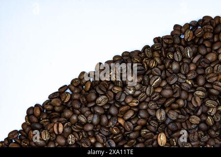 The coffee beans displayed on a plain white background. Stock Photo