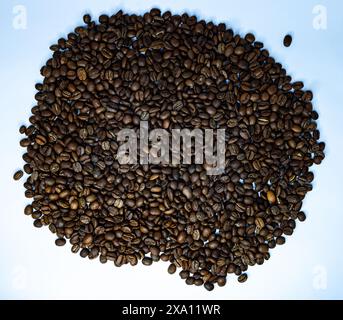 The coffee beans displayed on a plain white background. Stock Photo