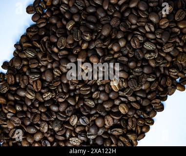 The coffee beans displayed on a plain white background. Stock Photo