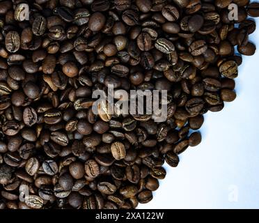 The coffee beans displayed on a plain white background. Stock Photo