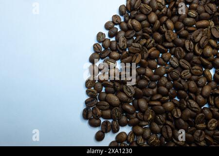 The coffee beans displayed on a plain white background. Stock Photo