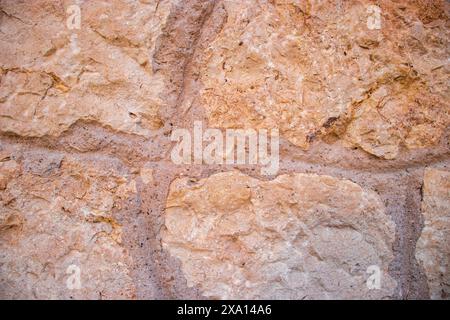 Close up Photograph of a Textured, Patterned wall on the facade of a historic buildung in El Papiol, Spain Stock Photo