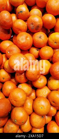 A pile of oranges on a table Stock Photo