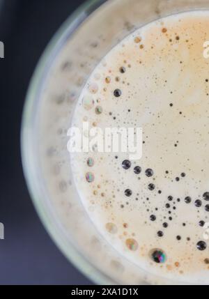 A closeup of freshly brewed coffee using a coffee machine in a glass Stock Photo