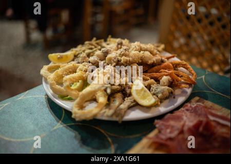 Assorted fresh fried fish dish in restaurant, Peñiscola, Castellon, Valencian Community, Spain Stock Photo