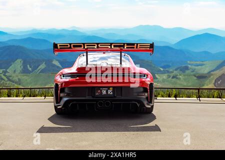 A stunning Guards Red 992 Porsche GT3 RS with Aurum Gold wheels Stock Photo