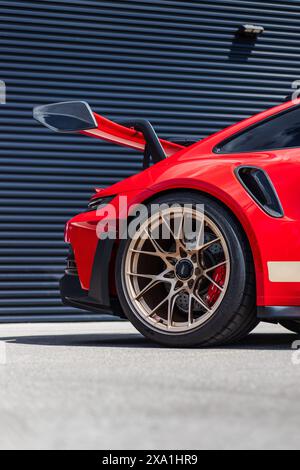 A stunning Guards Red 992 Porsche GT3 RS with Aurum Gold wheels Stock Photo