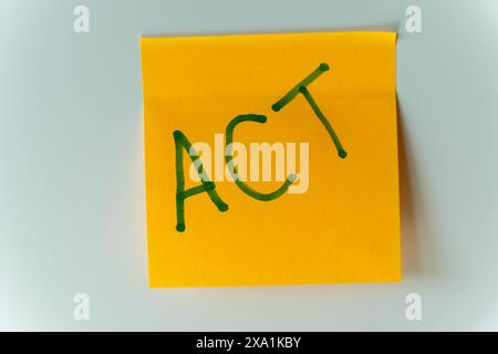 The word Action! handwritten on a white background Stock