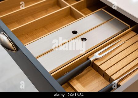 Close-up shot of dividers in modern kitchen drawer Stock Photo