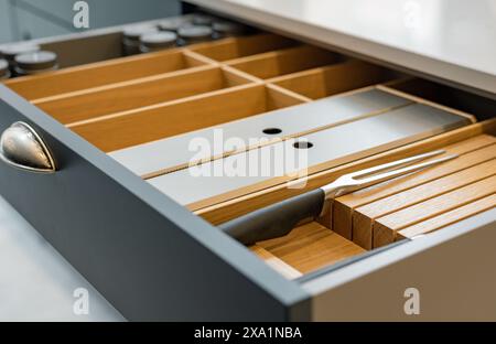 Close-up shot of dividers in modern kitchen drawer Stock Photo