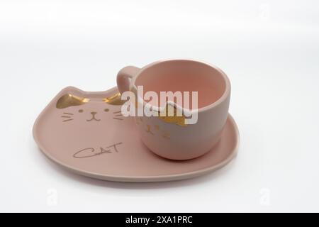 Cute cat teacup, coffee cup on a saucer Stock Photo