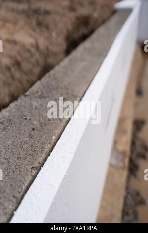 A close-up of concrete wall on a building in a n industrial site Stock Photo