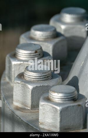 Close up of big nuts and bolts painted in silver Stock Photo