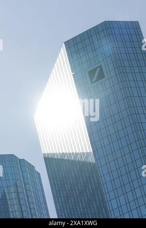 Low angle view of the Deutsche Bank skyscraper with the sun reflecting on the facade Stock Photo
