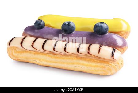 Delicious eclairs covered with glaze isolated on white Stock Photo