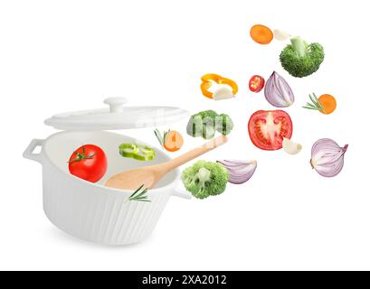 Fresh ingredients falling into saucepan on white background Stock Photo