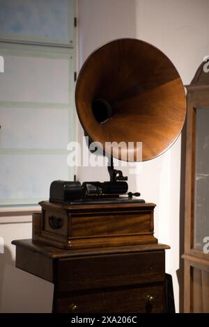 Vintage radio on wooden stand with clock Stock Photo
