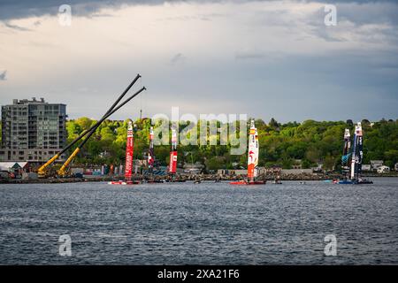 Teams launching their boats from Kings Landing during the June 2024 Sail GP event in Halifax, Nova Scotia, Canada. Stock Photo