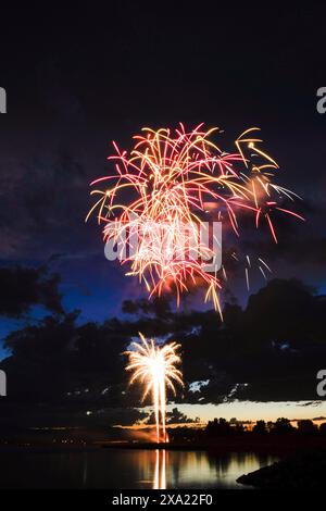 Vibrant fireworks illuminating the night sky, best viewed on a clear evening Stock Photo