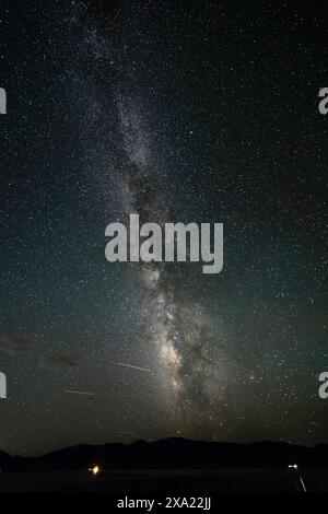 A night sky with stars and the Milky Way in the background Stock Photo