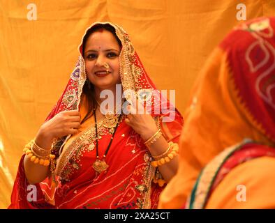 An Indian woman wearing traditional ethnic clothes - turmeric haldi ceremony Stock Photo