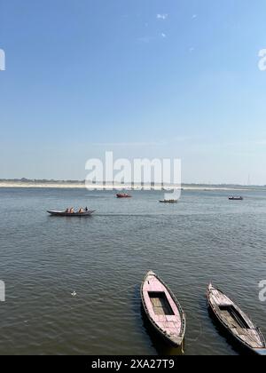 Multiple boats docked closely together in calm water Stock Photo