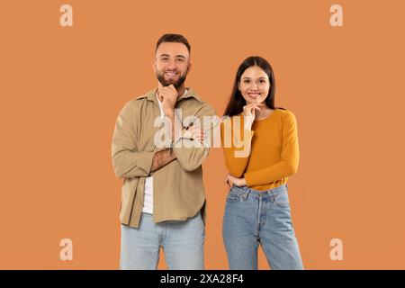 Young Smiling Man and Woman Standing Next to Each Other Stock Photo