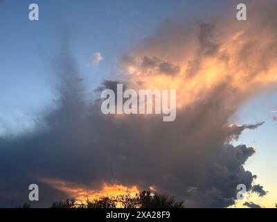 Dramatic storm clouds over a city skyline Stock Photo