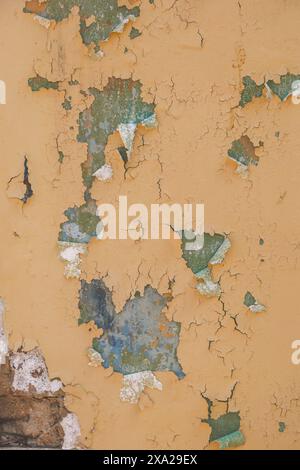 Close-up of a weathered wall with peeling paint Stock Photo