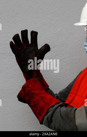 Fire proof gloves to handle dangerous substances Stock Photo