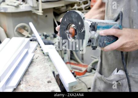 A Carpenter working in his studio Stock Photo